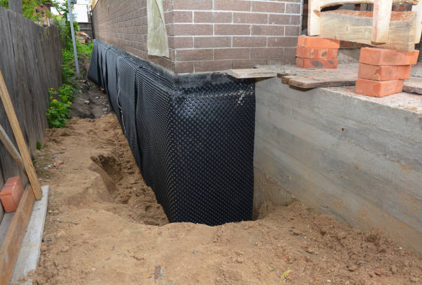 Happy homeowners after waterproofing job in Westminster